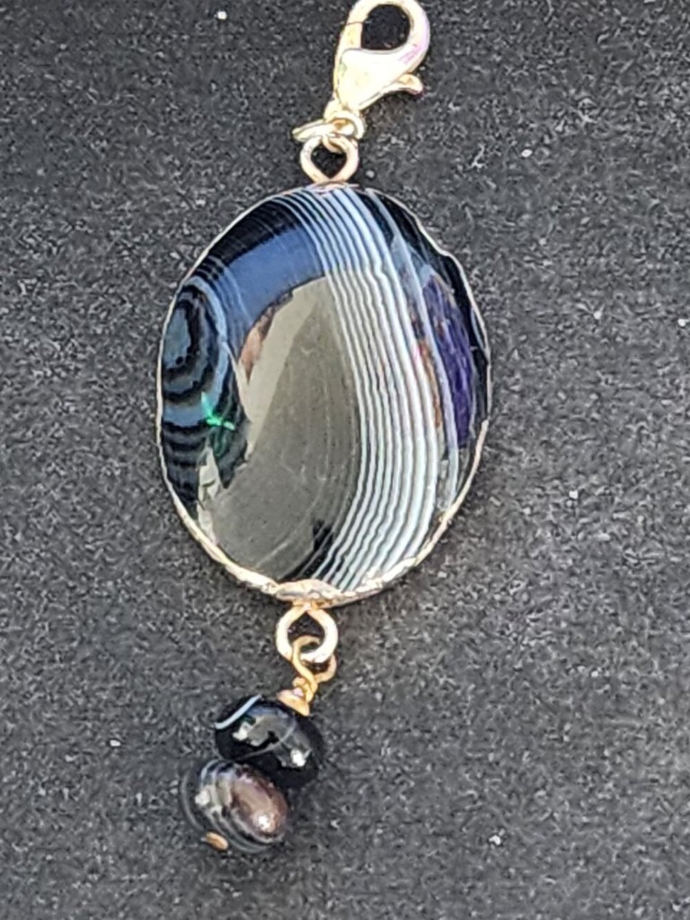 Banded black agate and onyx beads pendant  3.25 inch drop. 1.5 x 1 pendant